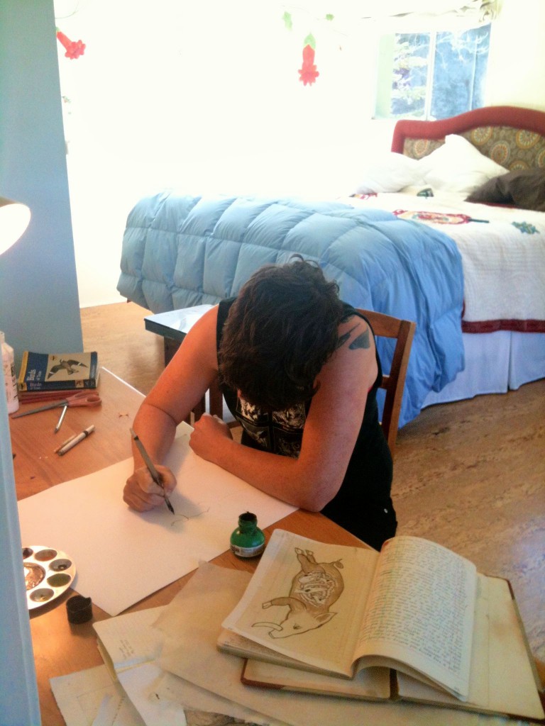 Resident Corinne Teed at work in her cabin